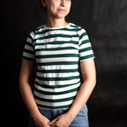 Woman wearing a classic green and white striped streetwear t-shirt by Beans.