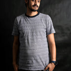 Man wearing The Men's Classic Stripe minimalist streetwear t-shirt by Beans.