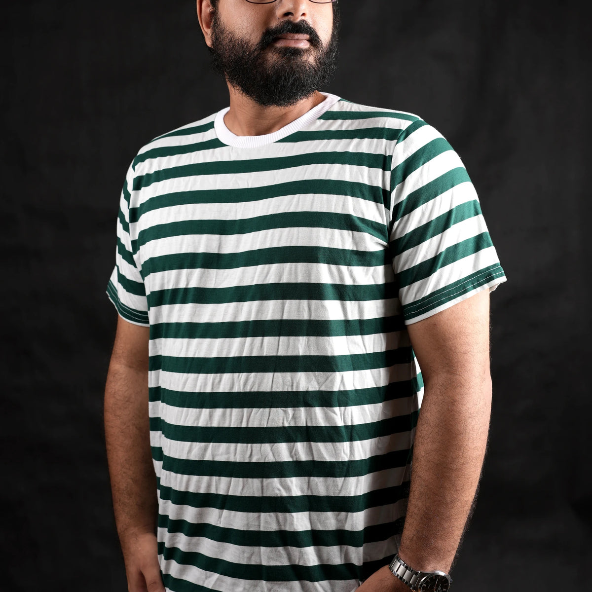 Man wearing The Men's Green Stripe regular fit streetwear t-shirt by Beans.