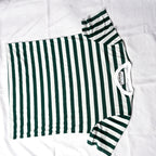 Beans green and white striped men's t-shirt laid flat on white backdrop.