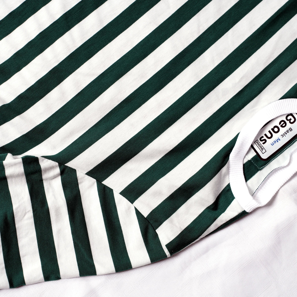 Beans green and white striped men's t-shirt laid flat on white backdrop.